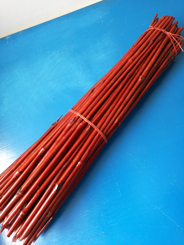red dyed bamboo sticks for flower support