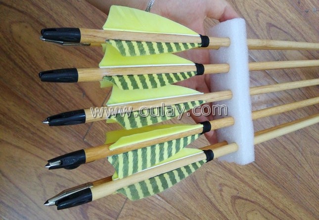beautiful wooden arrows with yellow striped fletchings